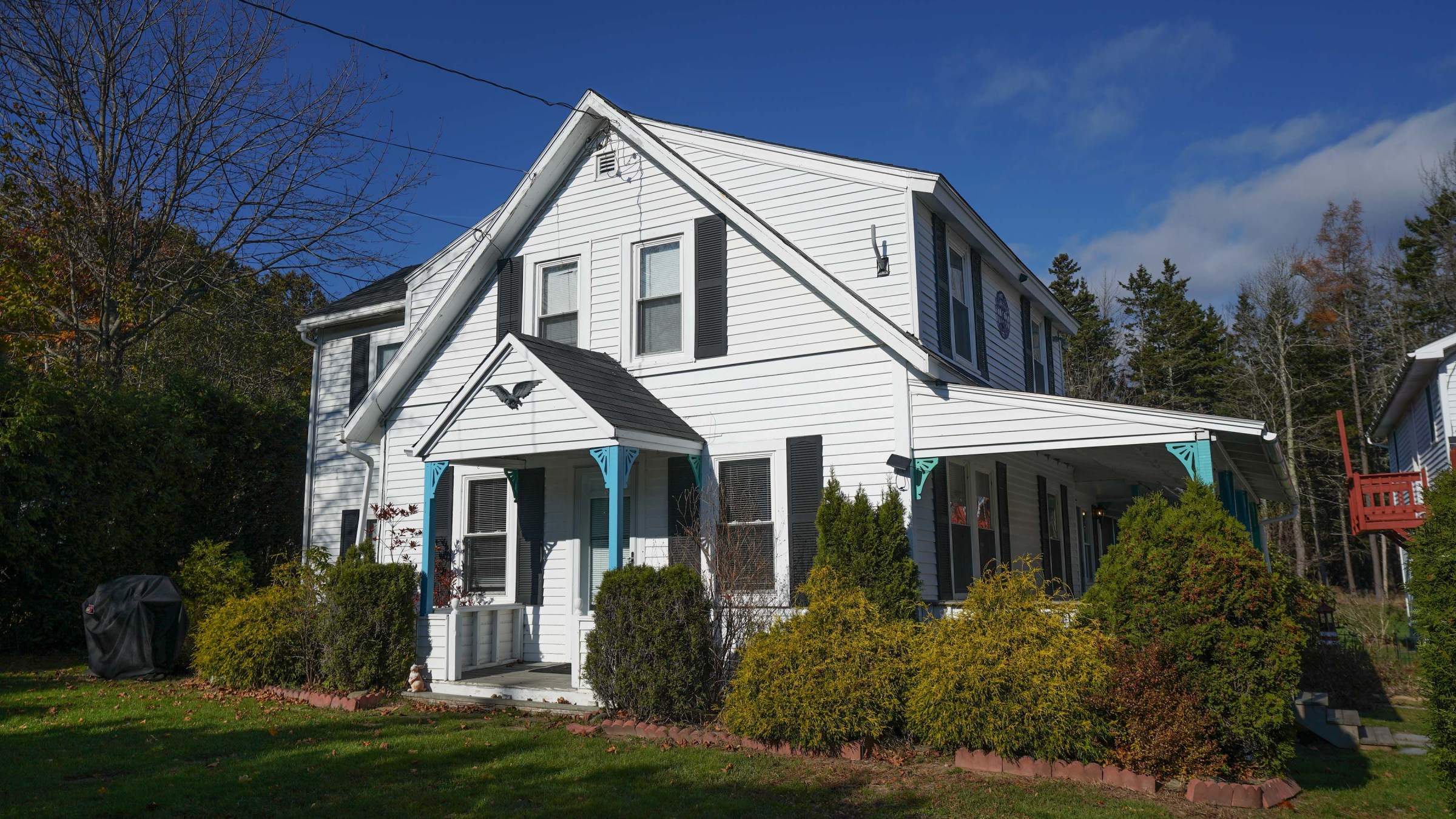 a house with trees in the front yard