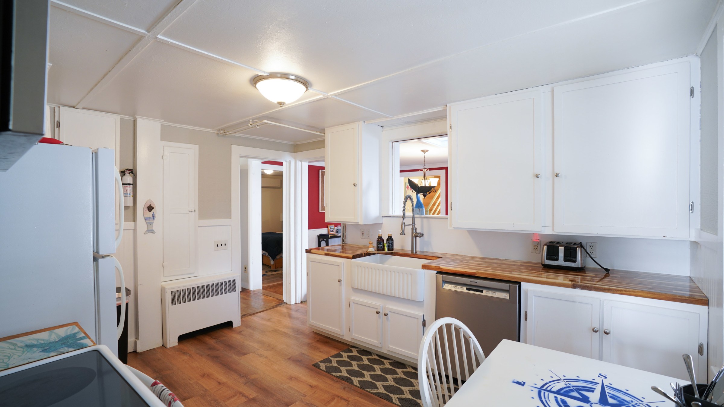 a kitchen with a stove top oven sitting inside of a room