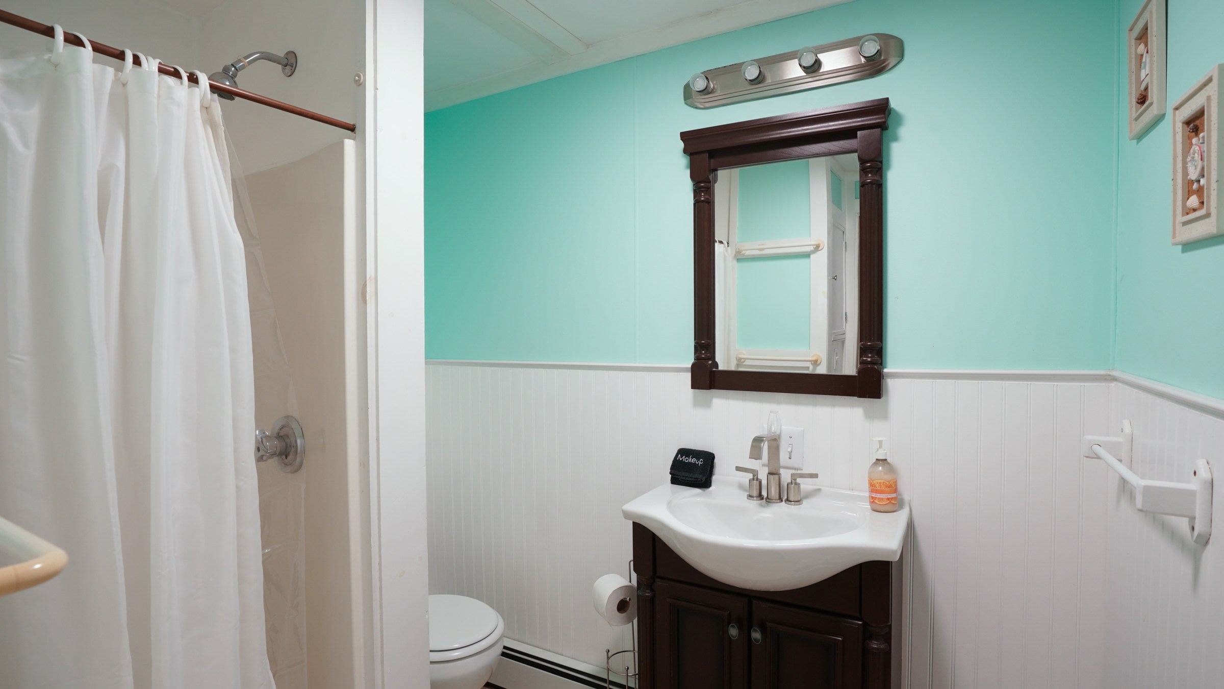 a room with a sink and a shower