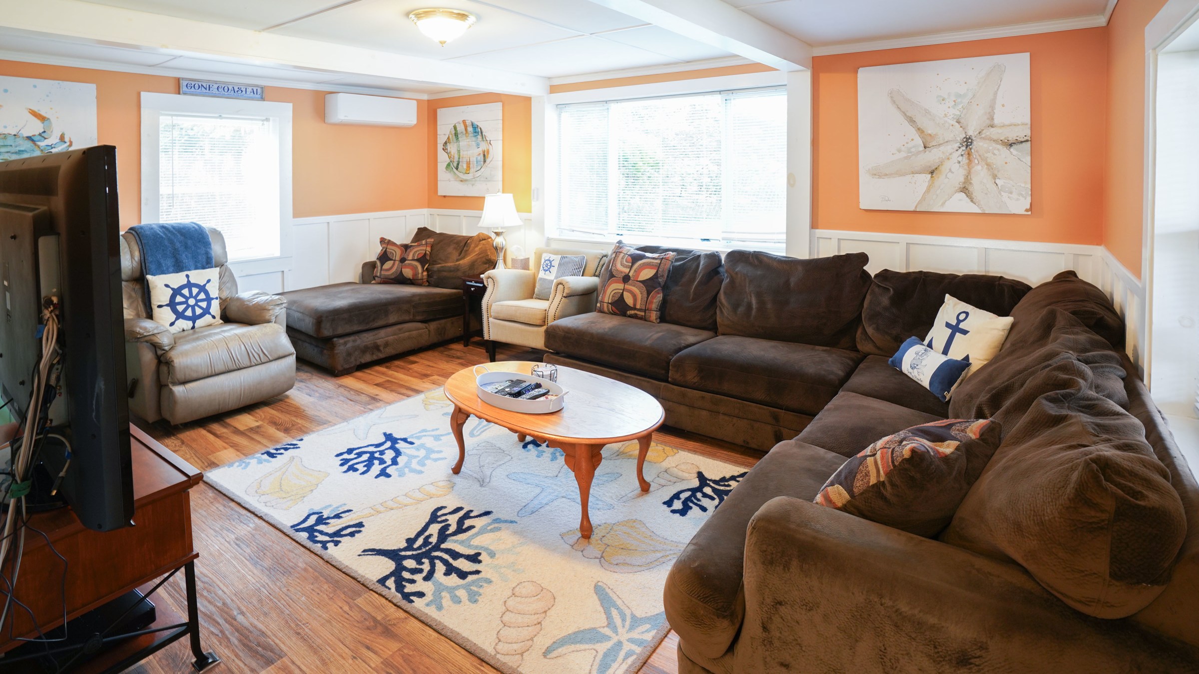 a living room filled with furniture and a fire place