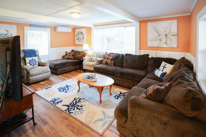 a living room filled with furniture and a fire place