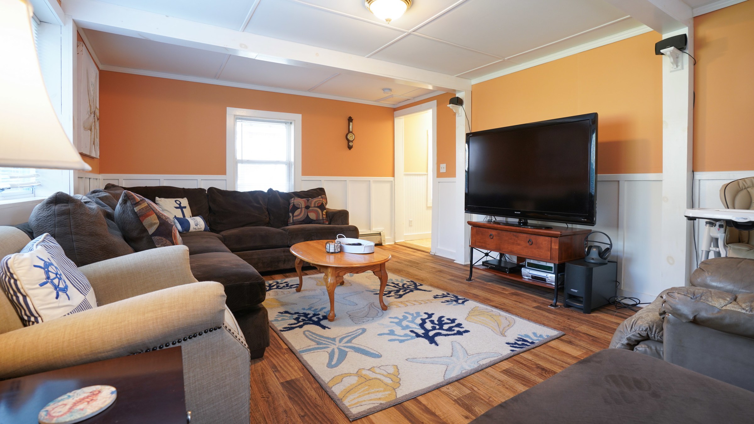 a living room filled with furniture and a fireplace
