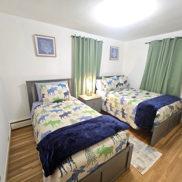 a bedroom with a bed in a room