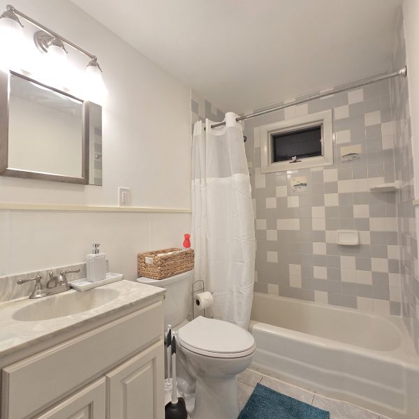 a room with a sink and a mirror