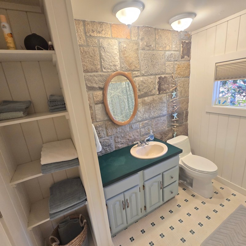 a room with a sink and a mirror