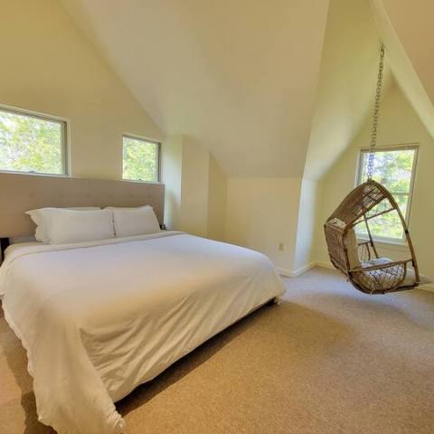 a bedroom with a bed in a room