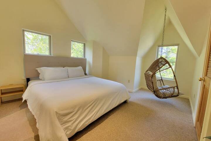 a bedroom with a bed in a room