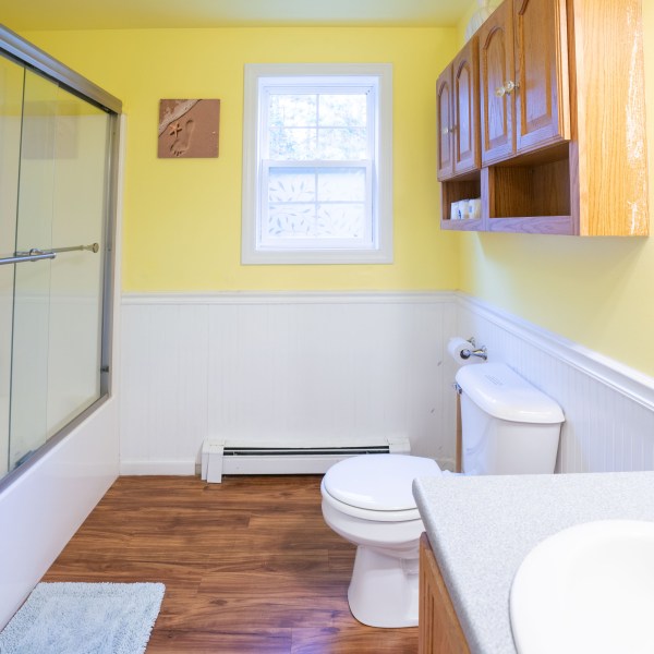 a room with a sink and a mirror