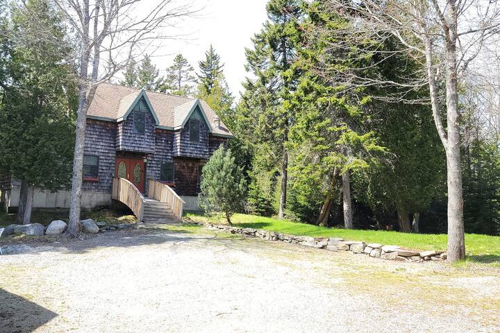 a house with trees in the background
