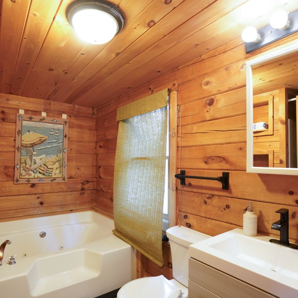 a room with a sink and a mirror