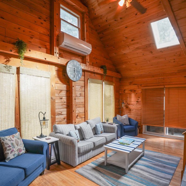 a living room filled with furniture and a fireplace