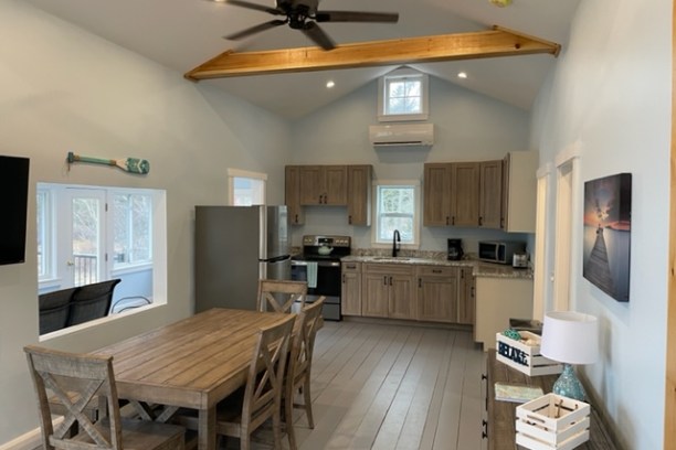 a kitchen with a dining room table