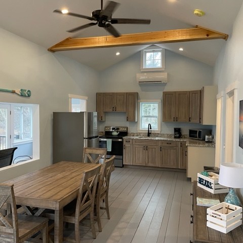 a kitchen with a dining room table