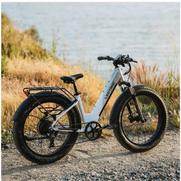 a motorcycle parked on the side of a dirt field