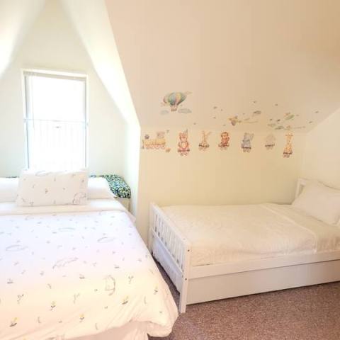 a bedroom with a bed in a room